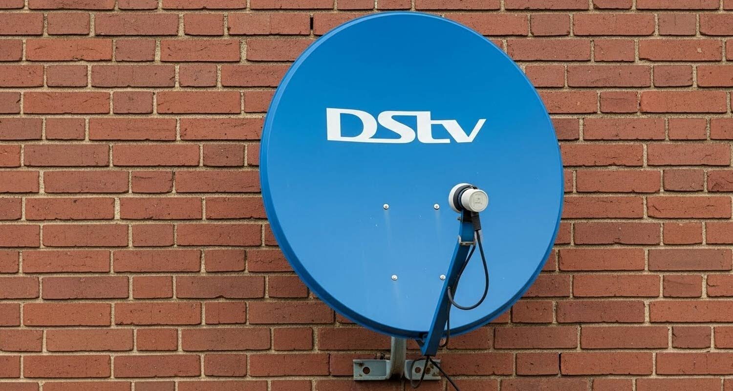 Satellite dish being reinstalled and realigned after a DStv relocation