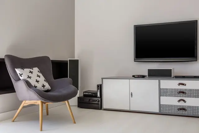 Smart television mounted in a modern living room